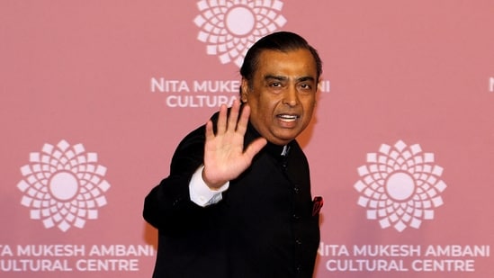 Mukesh Ambani, Chairman of Reliance Industries, waves on the red carpet during the second day of the opening of Nita Mukesh Ambani Cultural Centre (NMACC) at Jio World Centre, in Mumbai.(REUTERS)