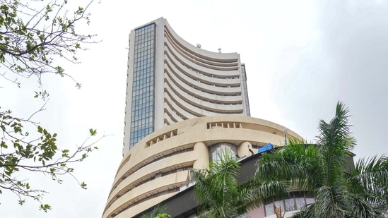 Pedestrians walk past the Bombay Stock Exchange (BSE) building, in Mumbai, Thursday.(PTI)