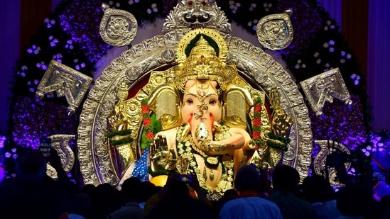 An idol of Lord Ganesha decorated with golden, silver and diamond ornaments on the eve of the 'Ganesh Chaturthi' festival at GSB Seva Mandal, in Mumbai on Sunday.(ANI)