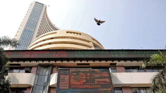 Indian share market: A bird flies past a screen displaying the Sensex results on the facade of the Bombay Stock Exchange (BSE) building in Mumbai.(REUTERS)