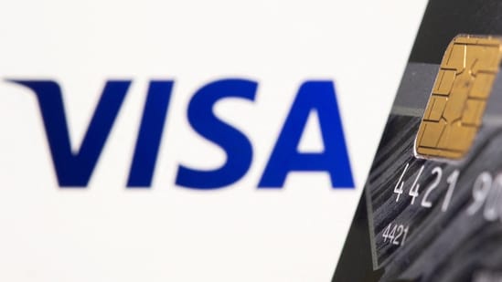 Credit card is seen in front of displayed Visa logo(REUTERS)