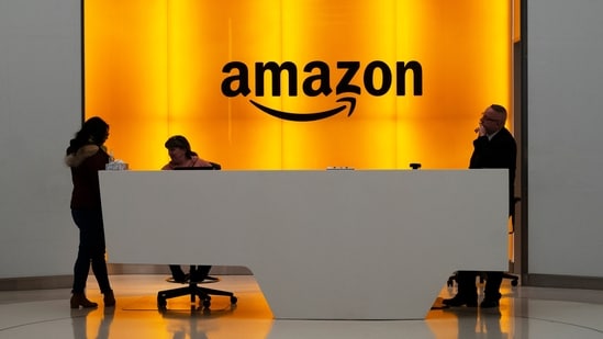 A file photo of people standing in the lobby for Amazon offices in New York.(AP file)