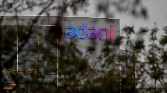 The logo of the Adani Group seen on the facade of its Corporate House on the outskirts of Ahmedabad.(REUTERS)