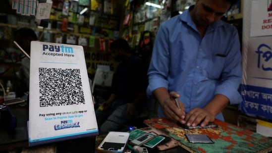  A QR code of Paytm is seen at a mobile repairing shop in Kolkata.(Reuters)