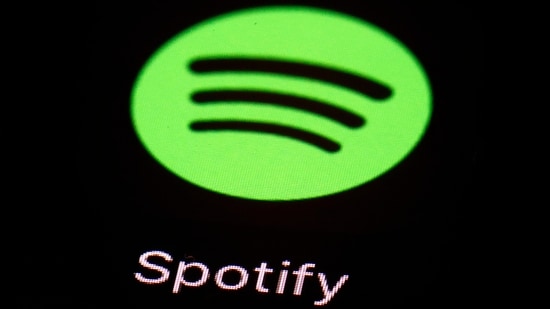 FILE- This March 20, 2018, file photo shows the Spotify app on an iPad in Baltimore. Spotify’s chief financial officer, Paul Vogel, is leaving next year, the music streaming service said, Friday, Dec. 8, 2023, — just days after the company announced its third round of layoffs for 2023. (AP Photo/Patrick Semansky, File)