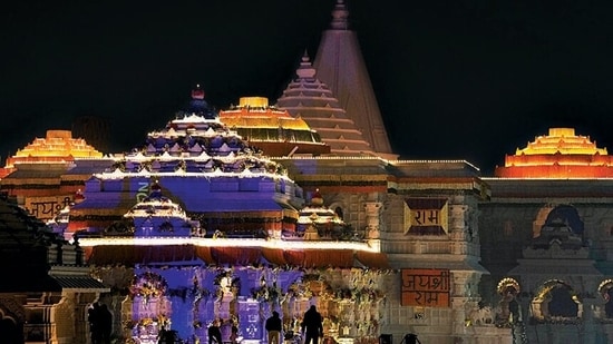 Ram Temple is lit up on Sunday ahead of the consecration ceremony. (PTI)(HT_PRINT)