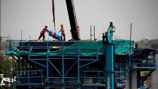 FILE PHOTO: Labourers work at a construction site of the Ahmedabad-Mumbai High Speed Rail corridor in Ahmedabad (REUTERS)