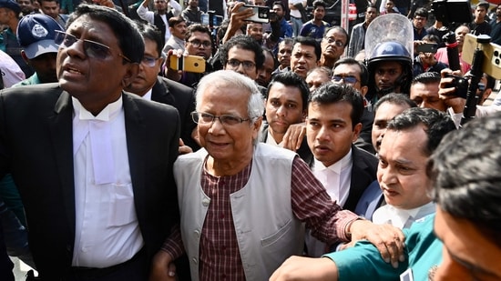 Bangladeshi Nobel peace laureate Muhammad Yunus (C) appears in a court in Dhaka on January 1, 2024.(AFP)