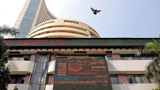 A bird flies past a screen displaying the Sensex results on the facade of the Bombay Stock Exchange (BSE) building in Mumbai, February 1, 2023. REUTERS/Niharika Kulkarni/File Photo(REUTERS)