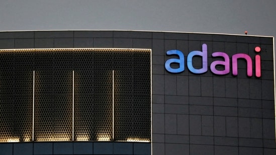 FILE PHOTO: The logo of the Adani group is seen on the facade of one of its buildings on the outskirts of Ahmedabad, India, April 13, 2021. REUTERS/Amit Dave/File Photo