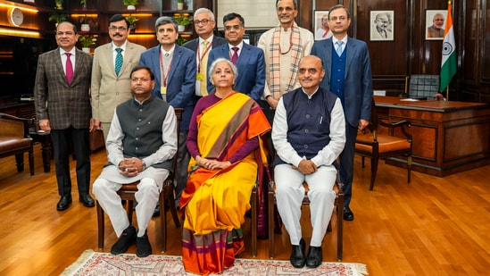 New Delhi: Union Finance Minister Nirmala Sitharaman with Ministers of State Pankaj Chaudhary and Bhagwat Karad and her team of officials a day before presentation of the Interim Budget 2024, at her North Block office in New Delhi, Wednesday, Jan. 31, 2024. (PTI Photo/Atul Yadav) 