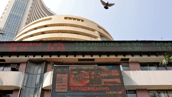 Sensex Today: A bird flies past a screen displaying the Sensex results on the facade of the Bombay Stock Exchange (BSE) building in Mumbai.(Reuters)