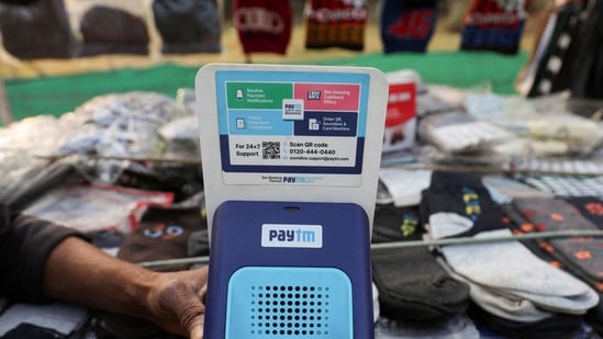 Cutlery vendor switches on Paytm, a digital payments firm, speaker to receive received payment details at a roadside market in Ahmedabad, India, February 5, 2024.REUTERS/Amit Dave/File Photo